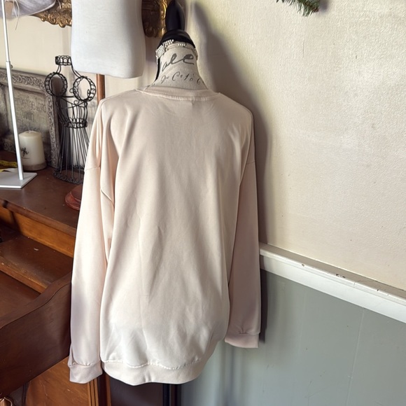 Cream Graphic Sweatshirt with Orange and Black Design - Picture 3 of 3